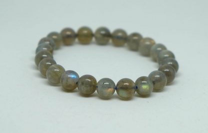 dark green and grey labradorite with vivid flashes of color