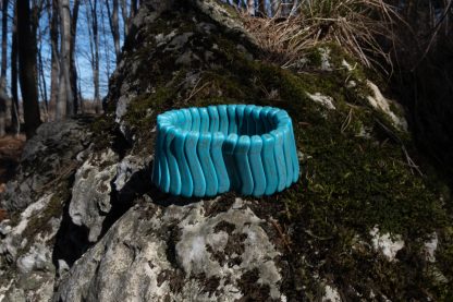 Blue greenish turquoise bracelet on a rock